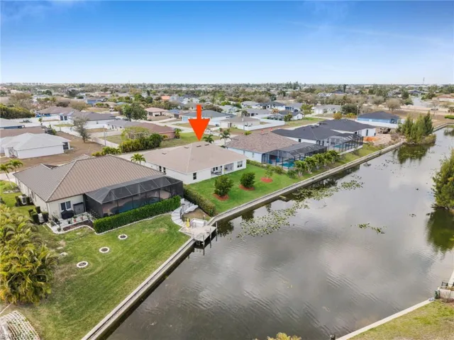Canal and rear view of the house from Aerial perspective