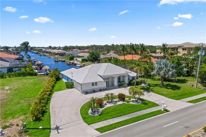 Bird's eye view with a water view and a residential view