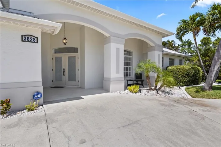 Entrance to property featuring stucco siding