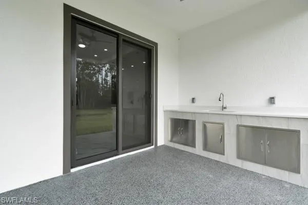 View of patio / terrace with a sink and an outdoor kitchen