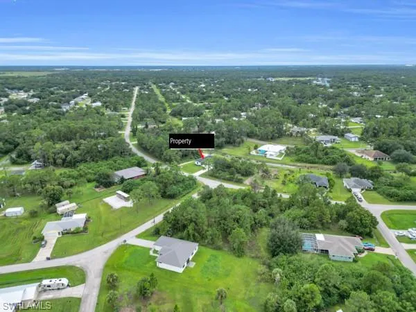 Aerial overview of property's location featuring nearby suburban area