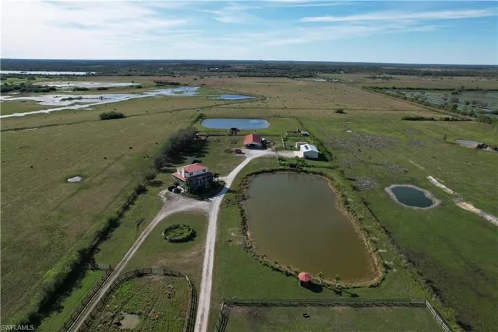 Drone / aerial view featuring a rural view and a water view