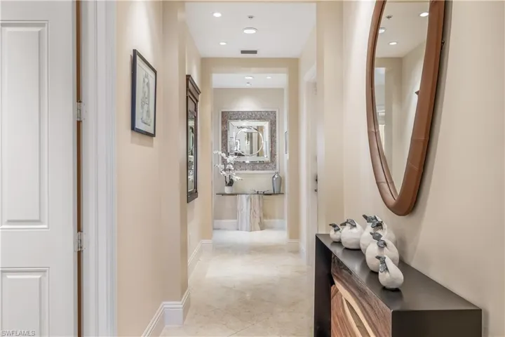 Hall with light tile patterned floors