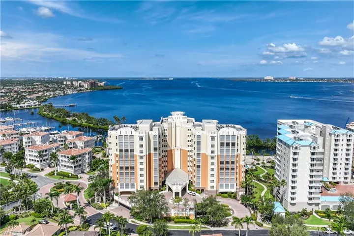 Birds eye view of property with a water view