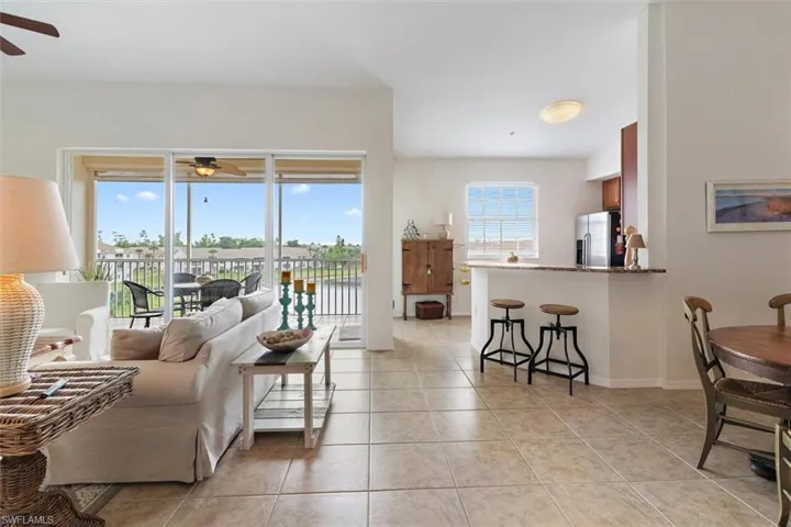 Open-concept living space with large format tile flooring throughout