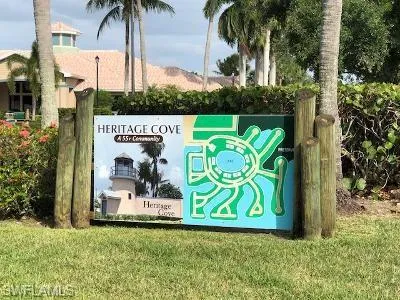Community sign featuring a lawn