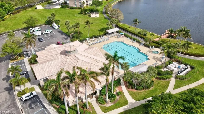 Drone / aerial view of a large body of water and a pool area