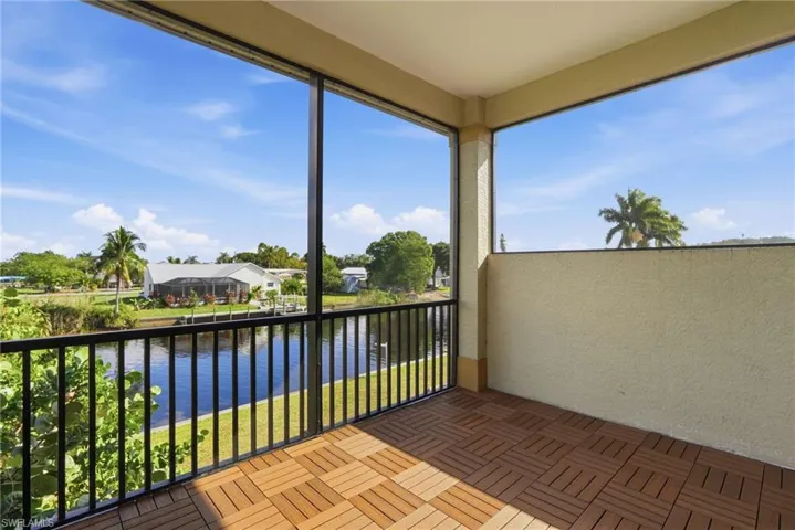 Unfurnished sunroom featuring a water view