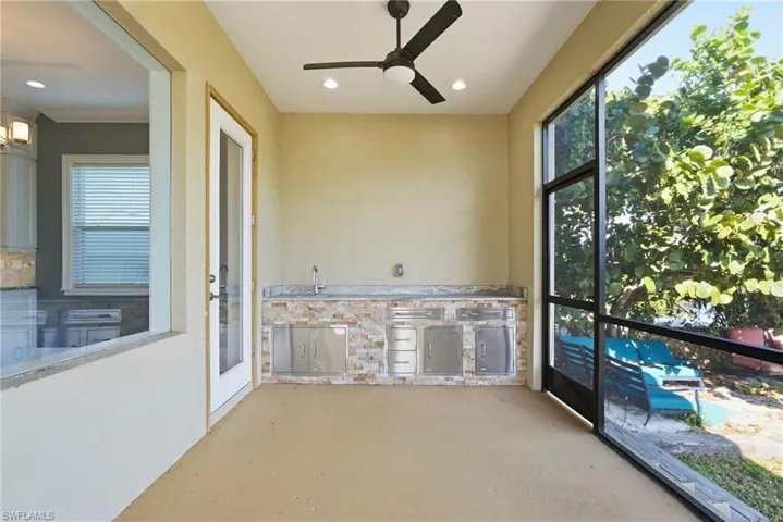 Unfurnished sunroom featuring a sink