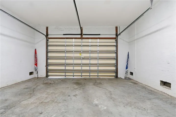 Large and deep garage with high ceilings perfect for vehicles and your Florida Life toys