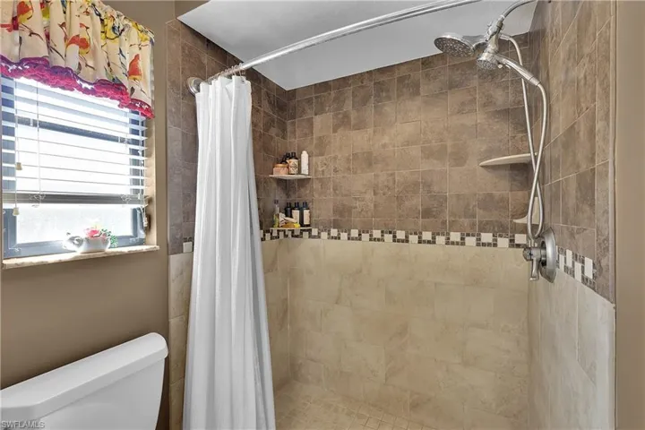 Full bath with a shower stall
