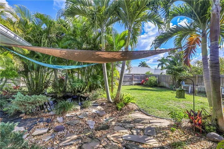 View of home's exterior featuring stucco siding and a sunroom