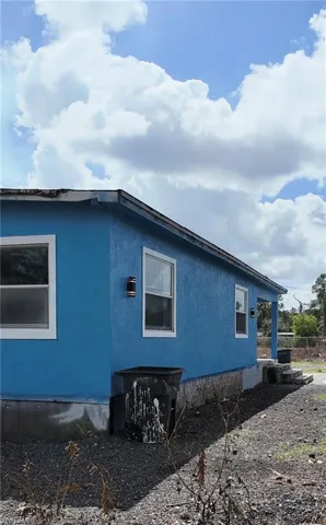 View of side of property with stucco siding