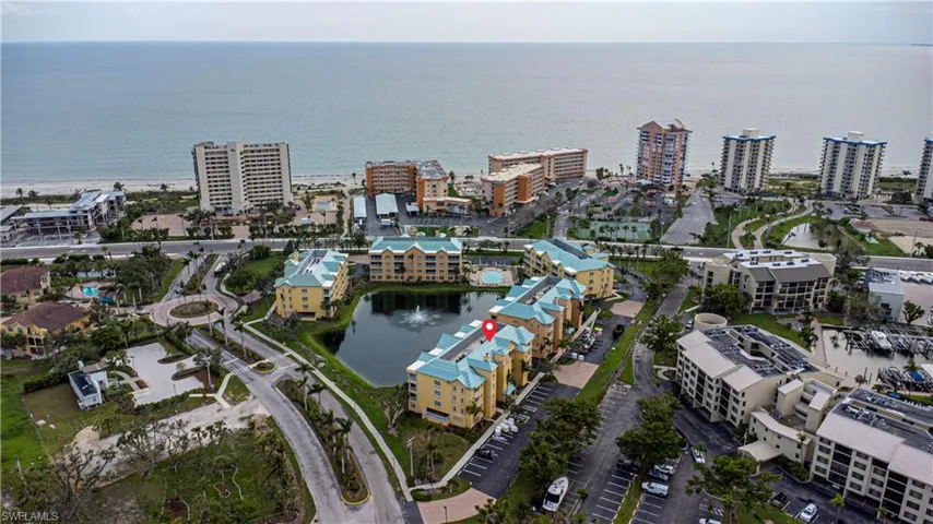 View of property location featuring a large body of water and nearby urban area