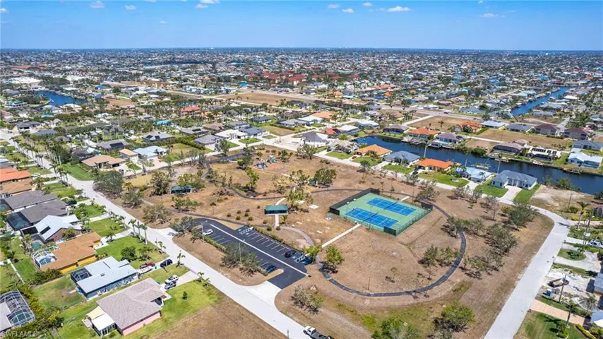 Aerial view featuring a residential view and a water view