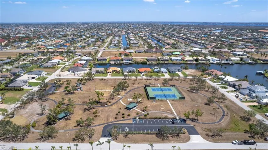 Drone / aerial view with a water view and a residential view