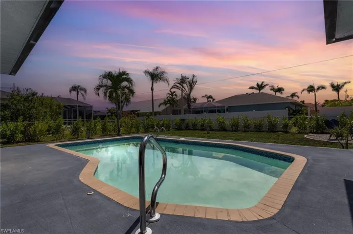 View of swimming pool featuring a fenced backyard, a fenced in pool, and a patio area