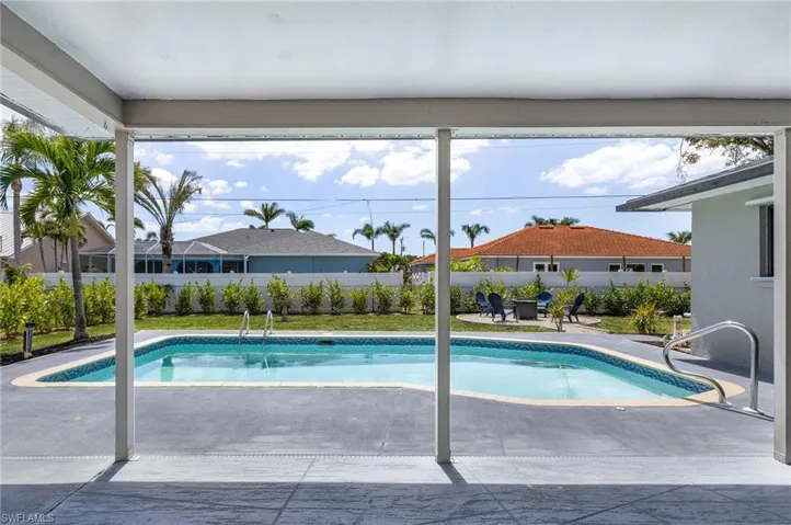 View of pool featuring a fenced backyard, a fenced in pool, and a patio area