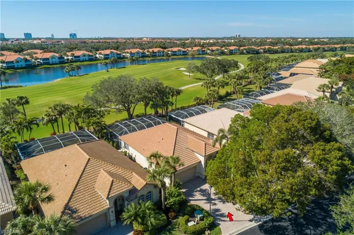 Aerial of house and lot, fairway and lake beyond