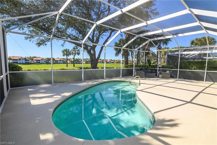 Large lanai with lagoon shaped heated pool. Lanai faces southwest for abundant sun.