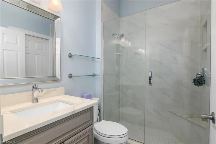 Guest bathroom, newly renovated...a side door leads to second guest bedroom and is across the hall from the street side guest bedroom/den.
