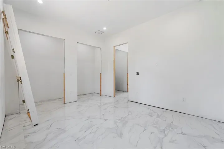 Guest House bedroom featuring two large closets