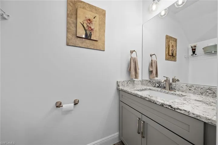 Bathroom with vanity and baseboards