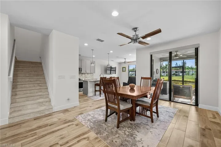Dining area featuring stairway, recessed lighting, and light wood-style flooring