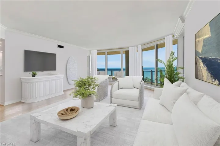 VIRTUAL STAGED Living area featuring ornamental molding and light wood-type flooring