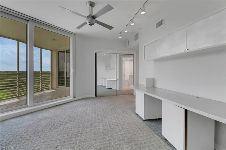 Full bathroom featuring a marble finish shower, vanity, toilet, recessed lighting, and marble look tiles