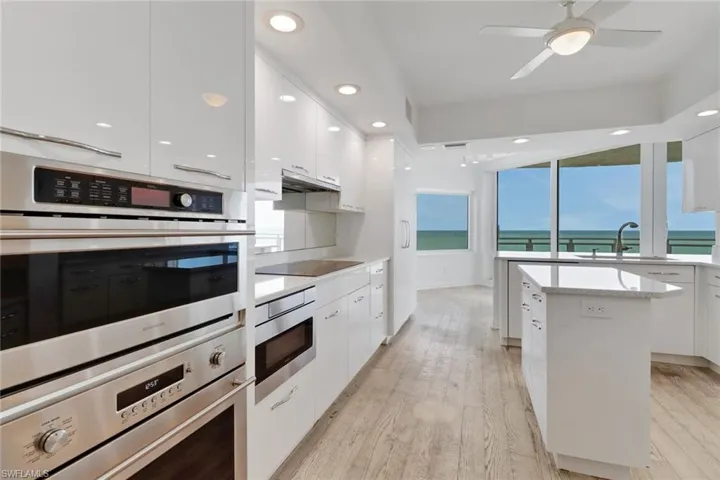 Kitchen SubZero side by side refrigerator/freeser and stainless steel Monogram appliances