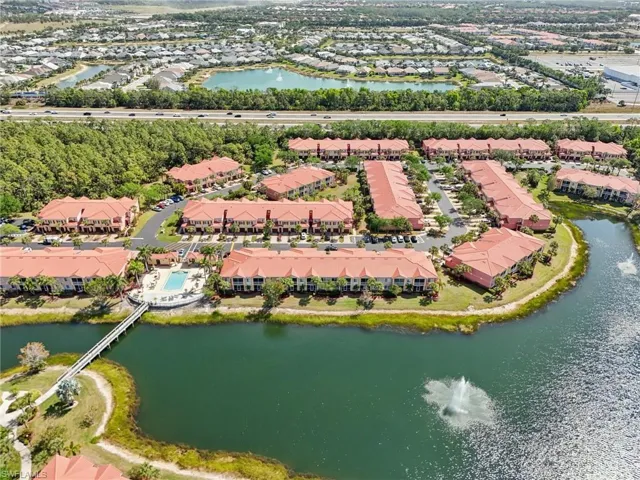 Aerial view featuring a water view and a residential view