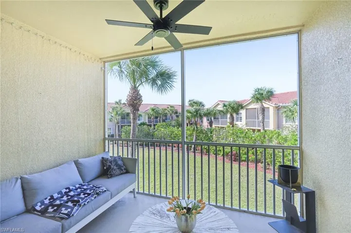 Balcony with a ceiling fan and an outdoor hangout area