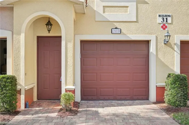 Garage featuring driveway