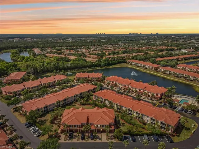 Drone / aerial view with a water view and a residential view
