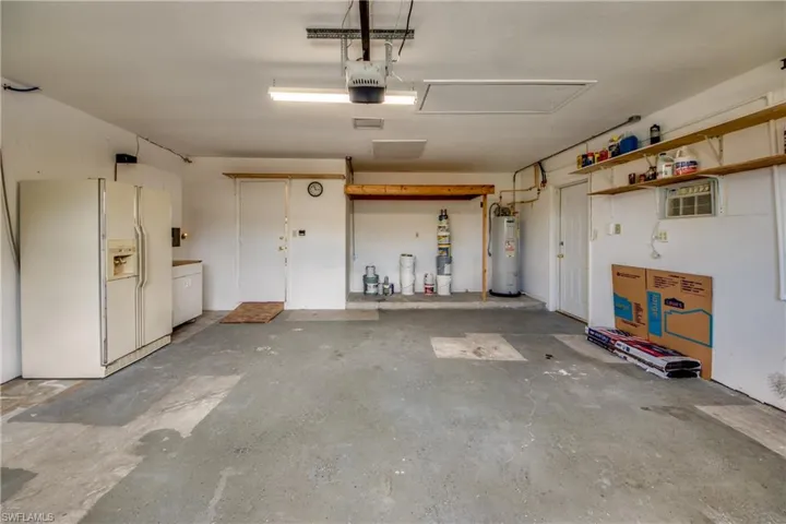 Original Garage with more storage above. Another Fridge.