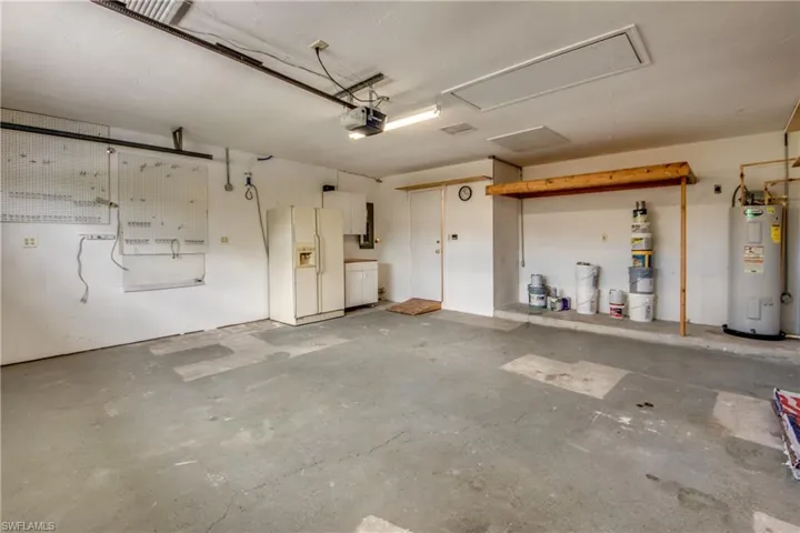 Original Garage with more storage above. Door to Laundry Room.