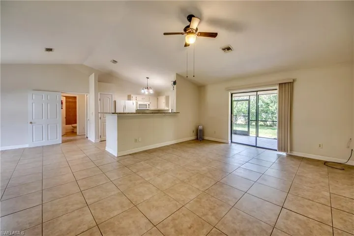 Living Room, Kitchen, Vaulted Ceiling, Door to Addt'l Bedrooms.
