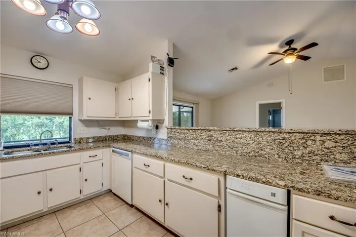 Kitchen featuring dishwasher, Dbl Sink & Trash Compactor