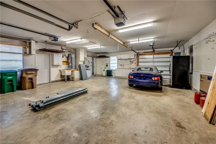Huge Newer Garage w/ 3 doors. 4-Foot Vent Fab in Attic above. Car not included :)