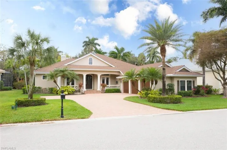 Mature front elevation with 3 custom garage doors