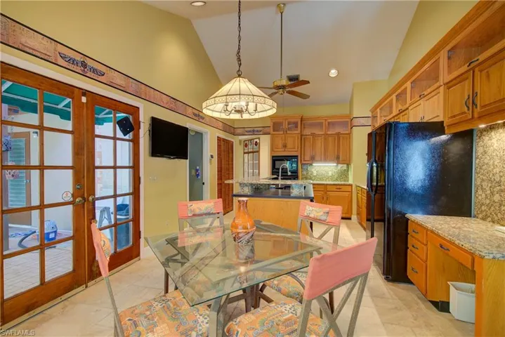 Dining area with french doors, high vaulted ceiling, recessed lighting, and ceiling fan