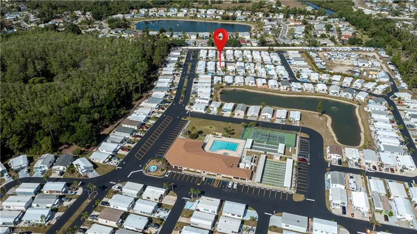 Birds eye view of property with a residential view and a water view
