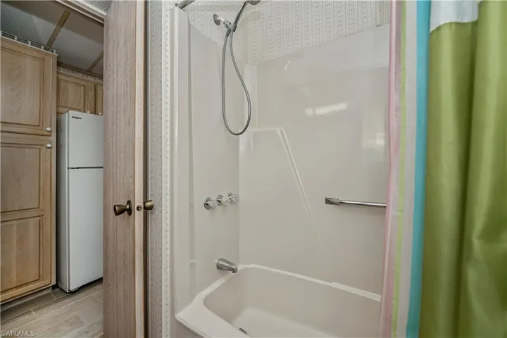 Full bathroom featuring wood finished floors
