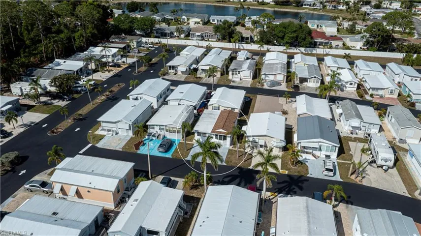 Aerial view featuring a residential view and a water view