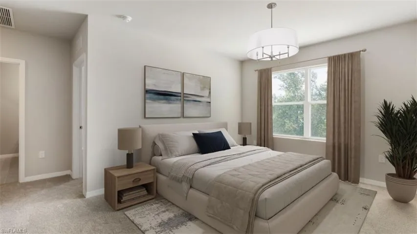 Bedroom with light colored carpet