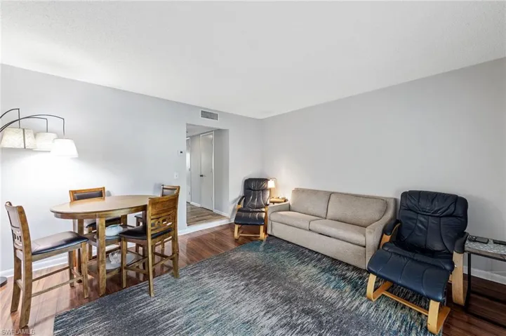 Living area featuring wood finished floors and baseboards