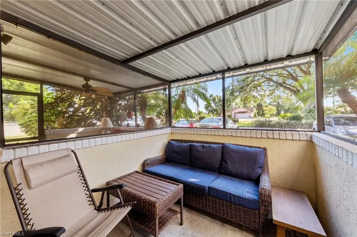 Sunroom / solarium with an outdoor hangout area and a ceiling fan
