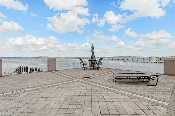 View of patio with a water view