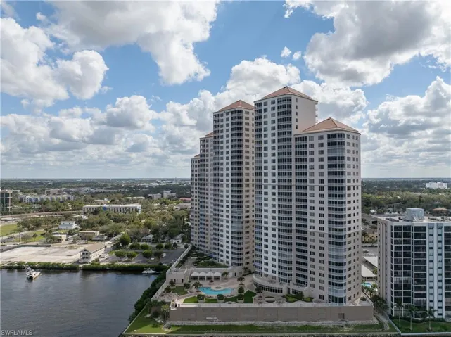 View of property with a water view